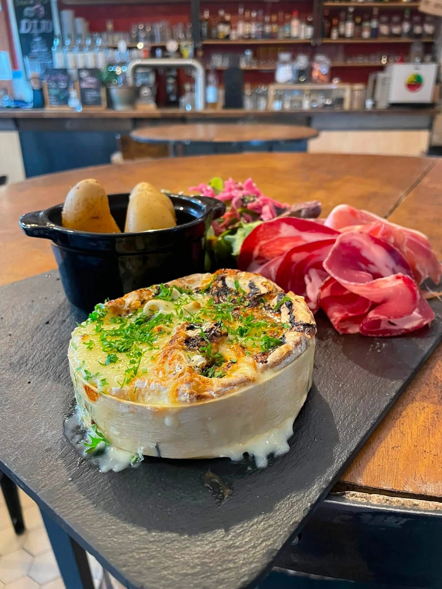 Baked camembert with cured meats
