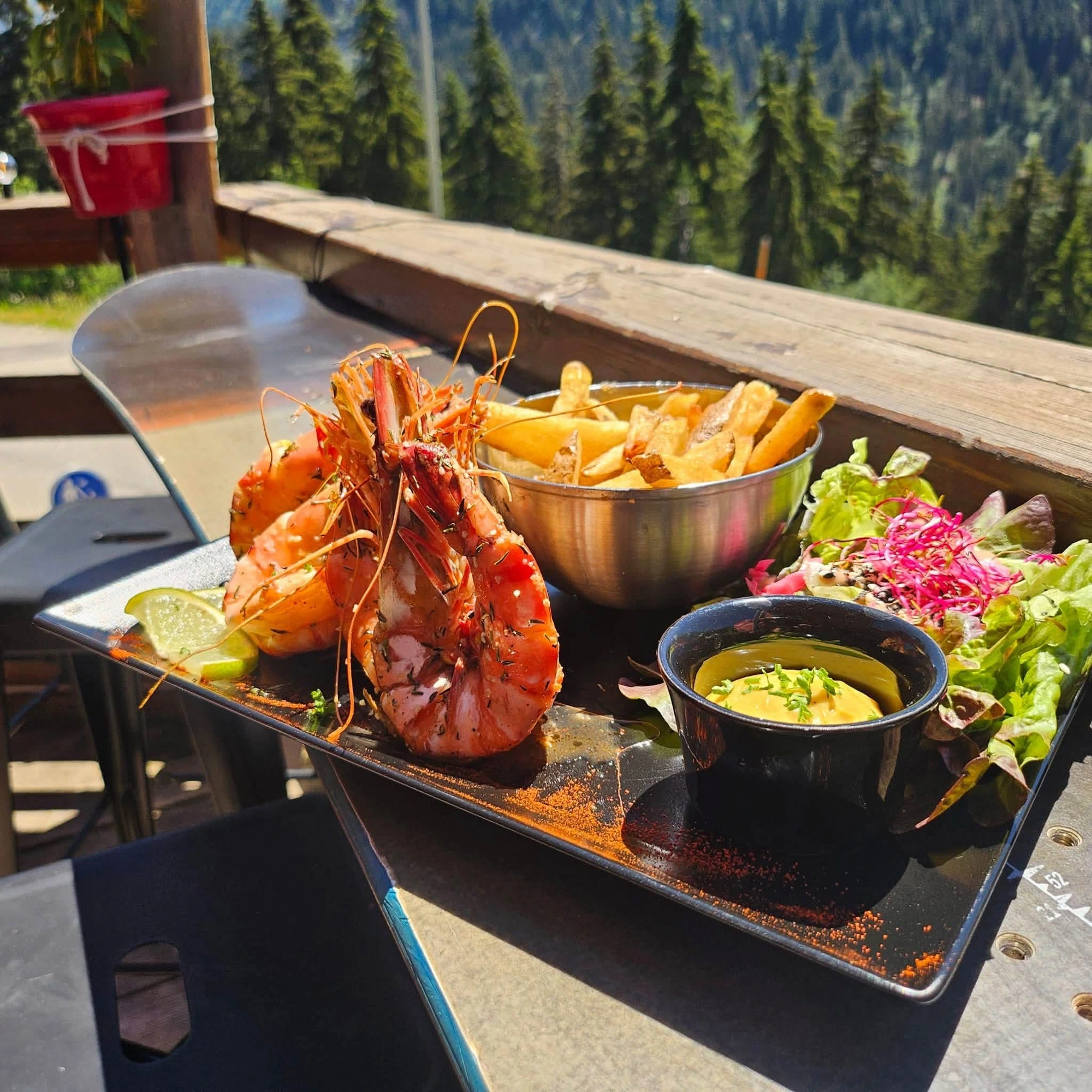 Roasted king prawns served on the terrace facing the mountains